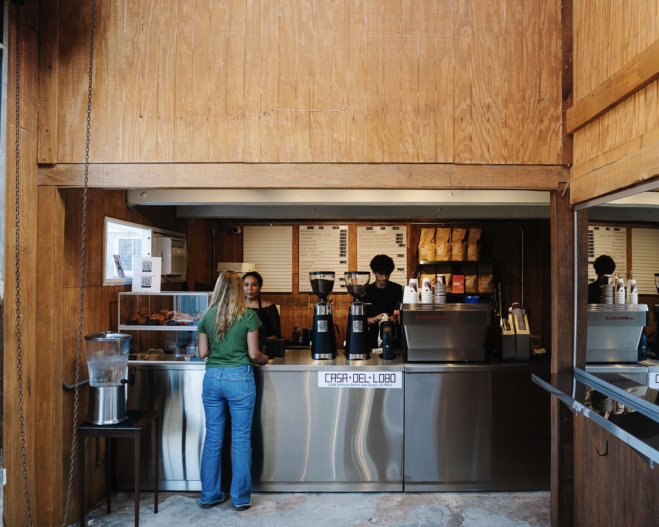 Baristas serving coffee at the Casa Del Lobo bar